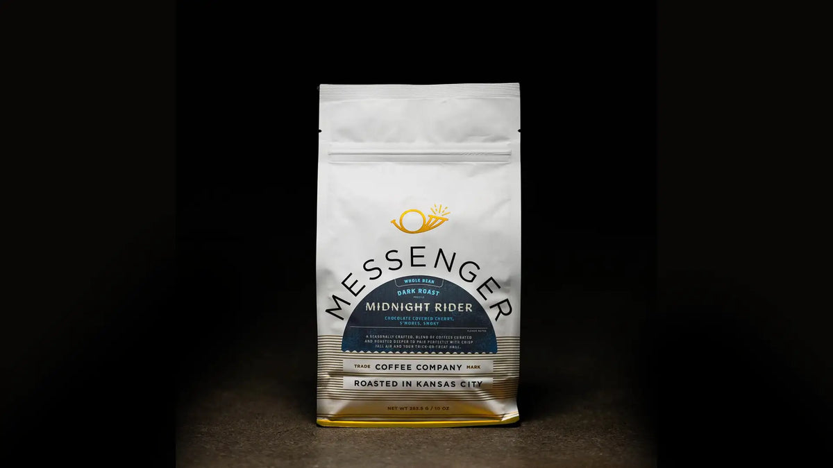Midnight Rider coffee bag labeled by Messenger Coffee Co. on a dark background with moody lighting