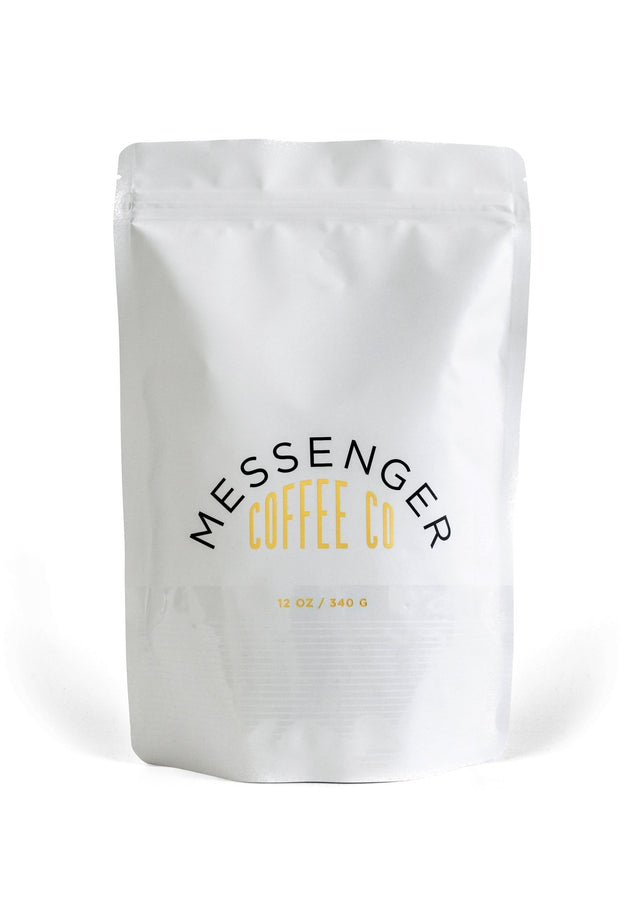Ethiopia Nguisse Nare Natural coffee in white Messenger Coffee Co bag with black and gold text, 12 oz size